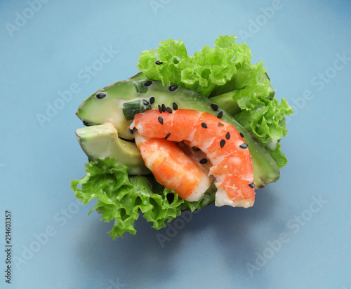 Plate with tasty salad in avocado boat on white background