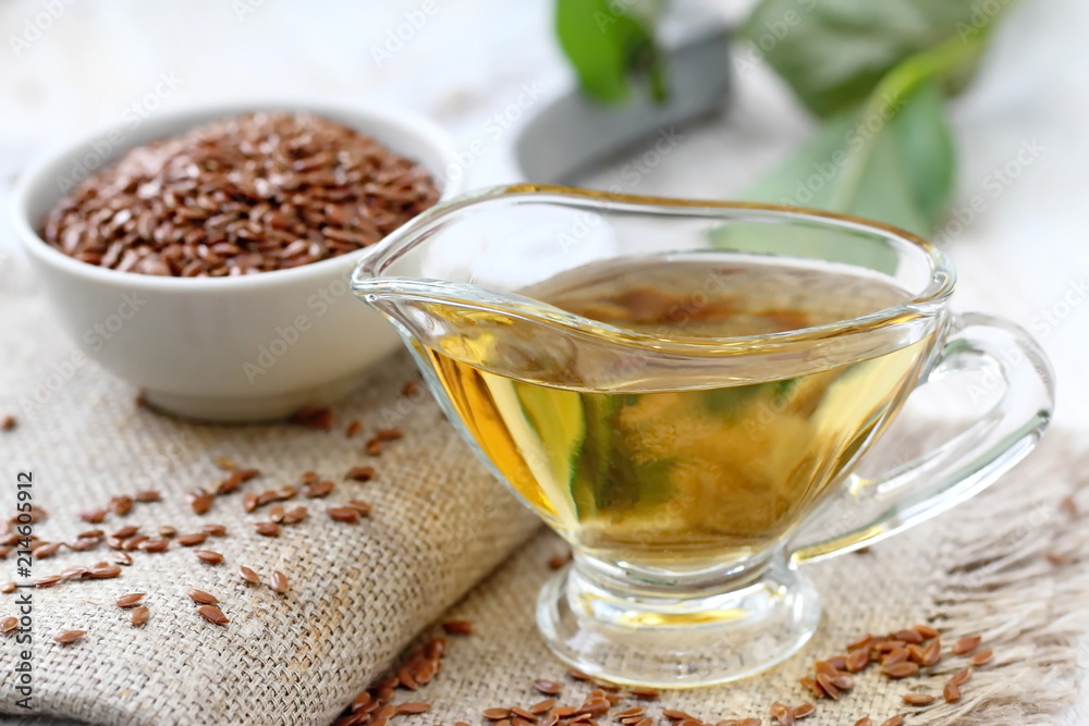 Linseed oil in glass and linen seeds Linseed oil in glass and linen seeds
