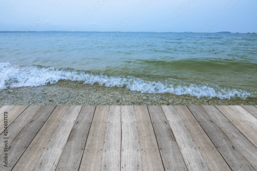 wood table for present your product on sea background