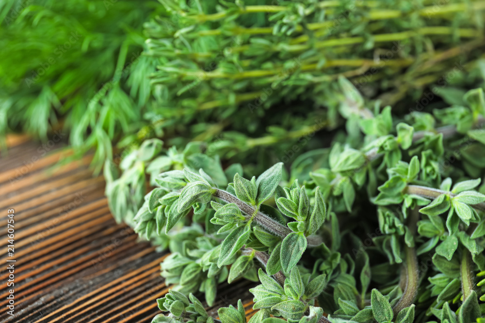 Fresh green oregano on wooden table Fresh green oregano on wooden table