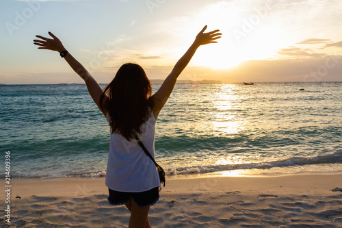 woman hand up feel relax on the beach on holiday