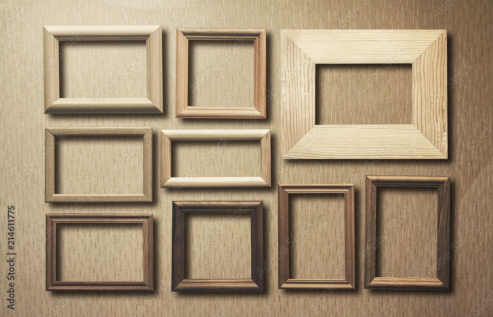 Fototapeta premium old frames on wooden wall
