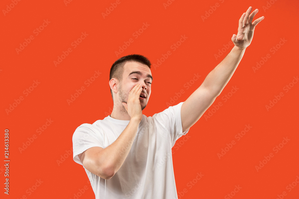 Isolated on pink young casual man shouting at studio