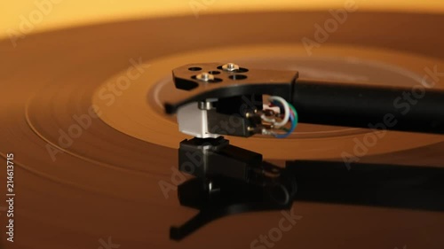 Lp vinyl record finishing to play on a turntable. Audio track ending. Vintage vinyl record on record player turntable. Audio equipment for club party. Soft focus. Close up