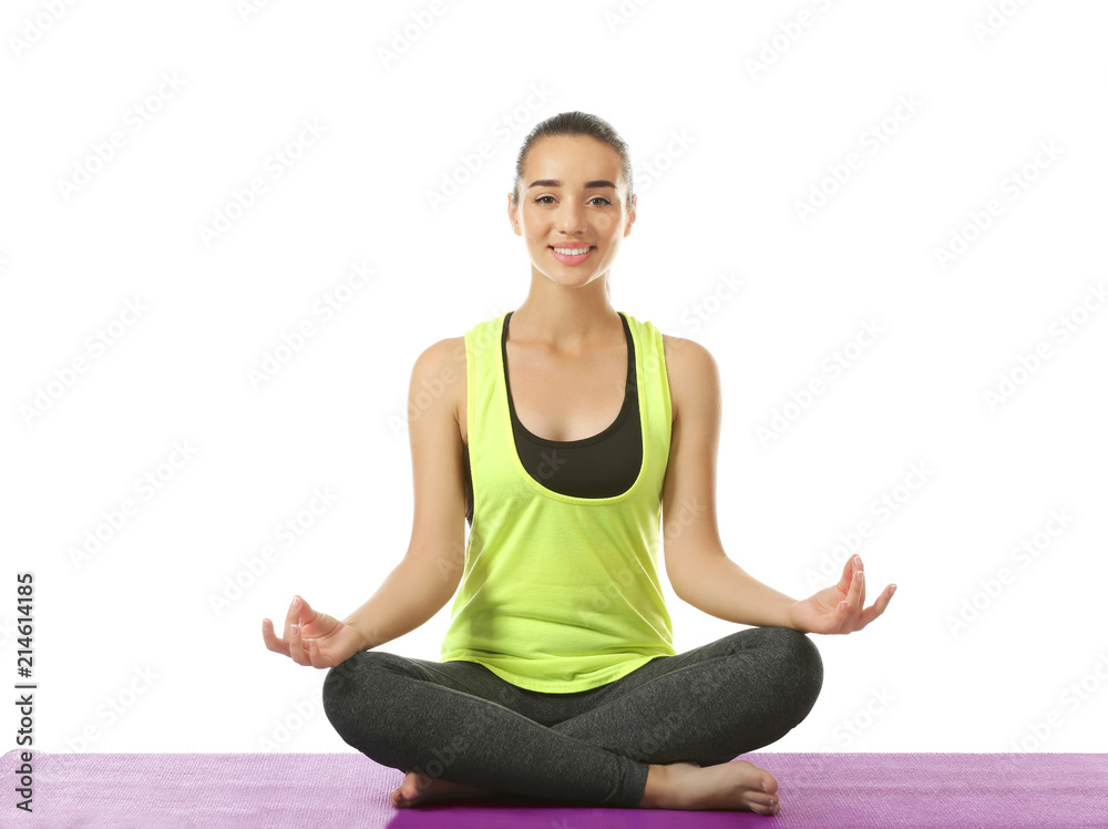 Young woman practicing yoga on white background