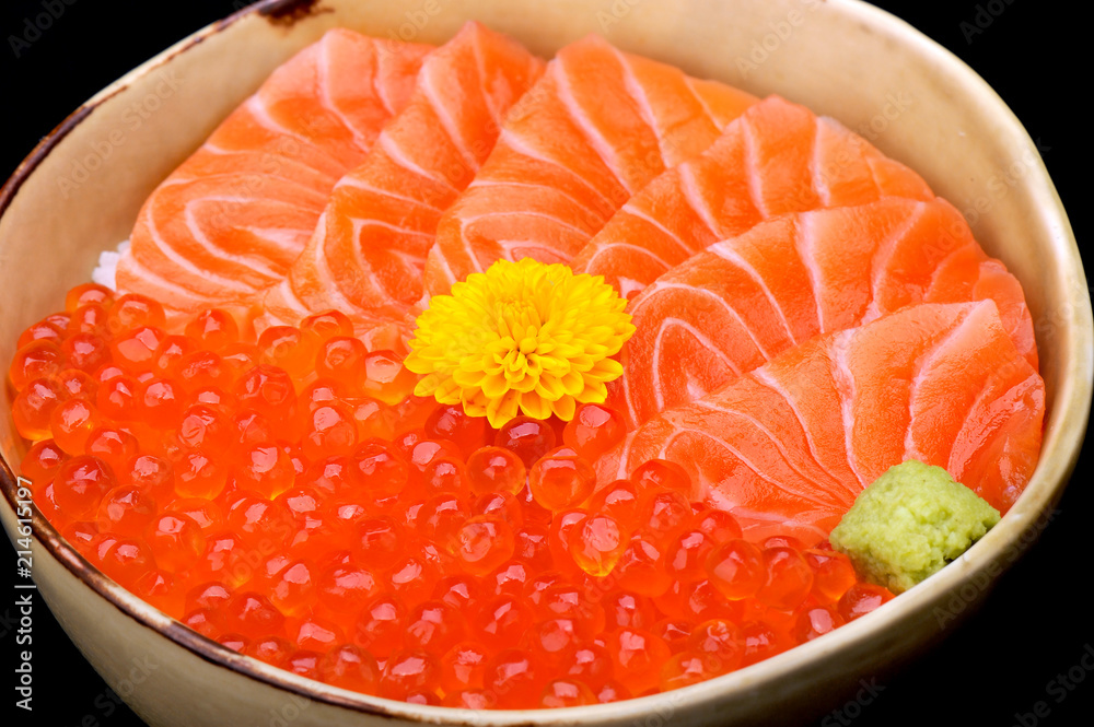 Raw salmon and salmon roe on rice bowl Raw salmon and salmon roe on rice bowl