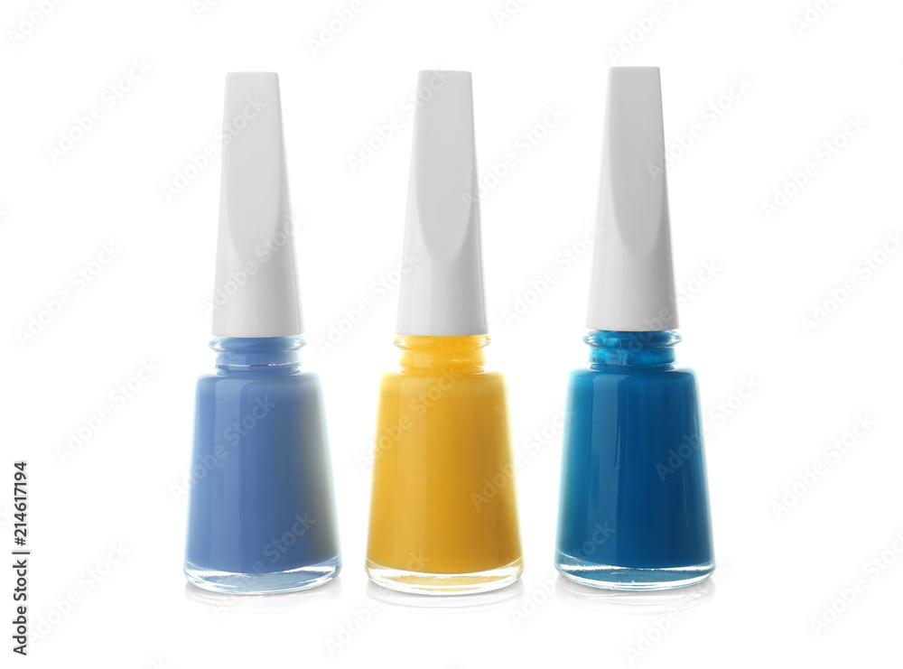 Bottles of colorful nail polishes on white background Bottles of colorful nail polishes on white background