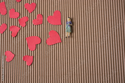 Canvas Print Woman figurine and Love concept with paper hearts