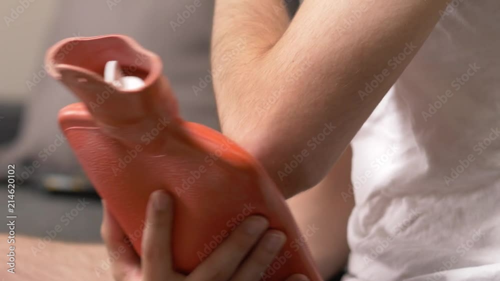 custom made wallpaper toronto digitalFeeling pain in the elbow area and holding a hot water bag on it to relief the pain from the injury