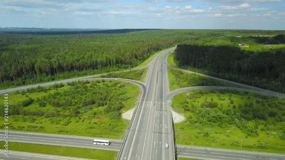 movement of vehicles at a transport junction. aerial shot on summer day movement of vehicles at a transport junction. aerial shot on summer day