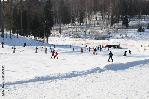 Ski slope, people skiing down the hill, mountains view. Cesis. Latvia