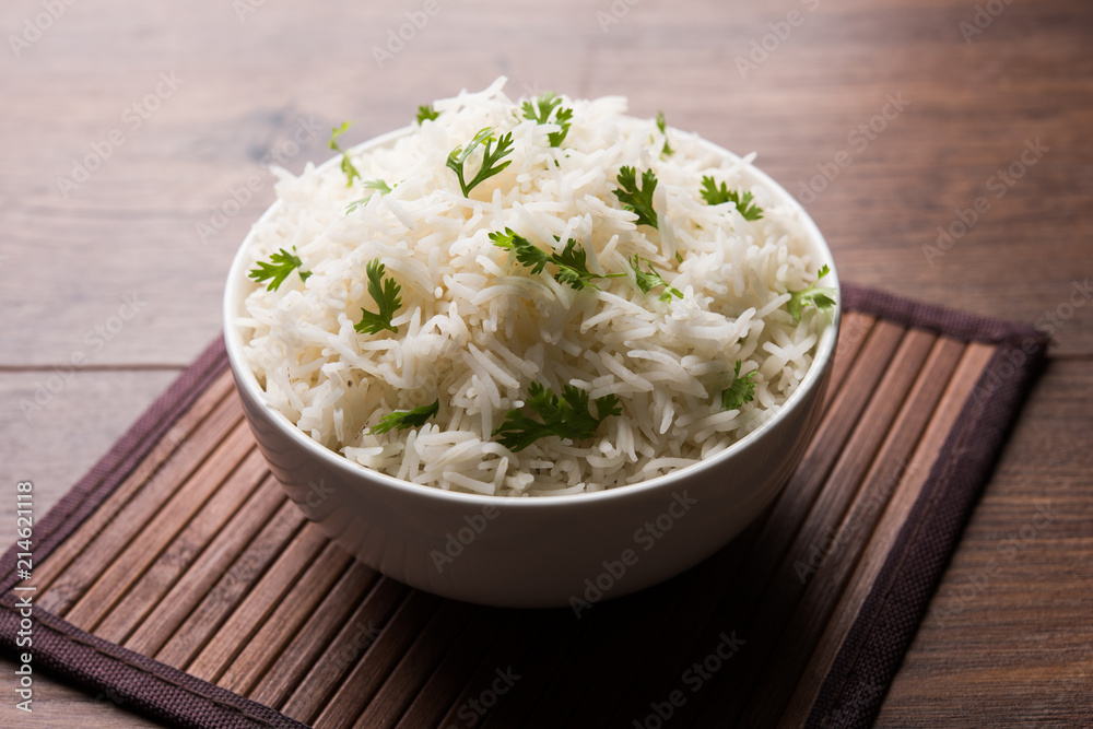 Coriander or cilantro Basmati Rice, served in a ceramic or terracotta bowl. It's a popular Indian OR Chinese recipe. Selective focus Coriander or cilantro Basmati Rice, served in a ceramic or terracotta bowl. It's a popular Indian OR Chinese recipe. Selective focus