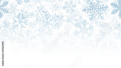 Christmas background of many layers of snowflakes of different shapes, sizes and transparency. Gradient from light blue to white