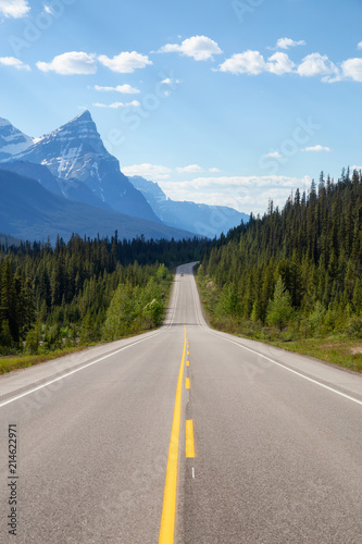 Scenic road in the Canadian Rockies during a vibrant sunny summer day. Taken in Icefields Parkway, Banff National Park, Alberta, Canada. © edb3_16