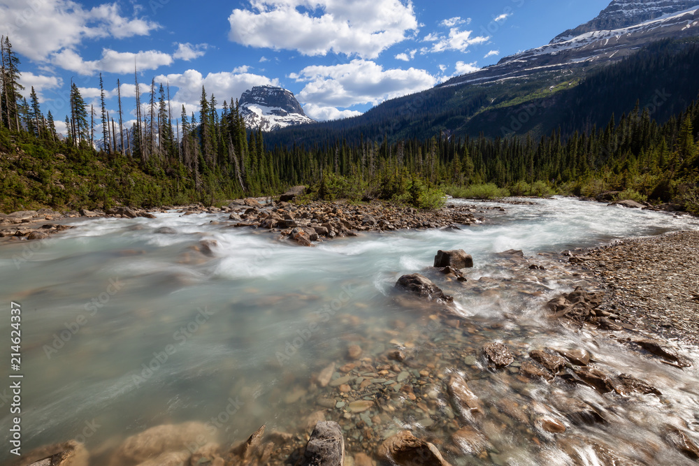 Takakkaw Falls in Yoho National Park during a vibrant sunny summer day. Located in British Columbia, Canada.