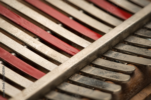 Thumb piano (Kalimba, Mbira) with silver and red tines photo