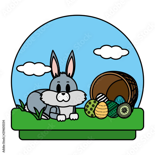 color rabbit lying and hamper with eggs easter