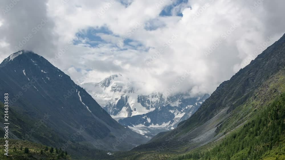 The clouds swirl over the top of the Belukha mountain. Altai, Russia. TimeLapse. The clouds swirl over the top of the Belukha mountain. Altai, Russia. TimeLapse.