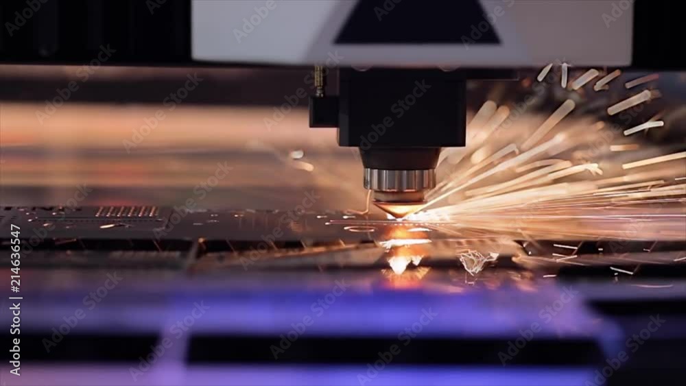 CNC Laser cutting of metal in slow motion, modern industrial technology.
