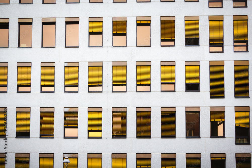 office high-rise house facade with gold chrome louvres office high-rise house facade with gold chrome louvres