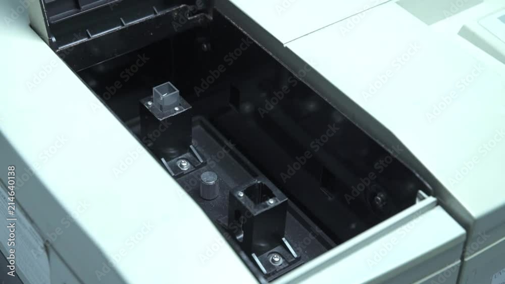 Scientis Putting A Tiny Transparent Pot In A Machine - Slide Shot - Right To Left Scientis Putting A Tiny Transparent Pot In A Machine - Slide Shot - Right To Left