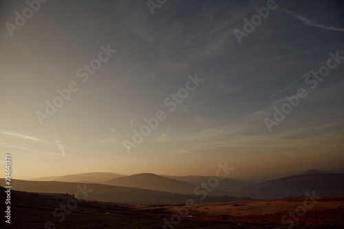 Sunset overlooking mountains in the Brecon Beacons, Wales. © Tom