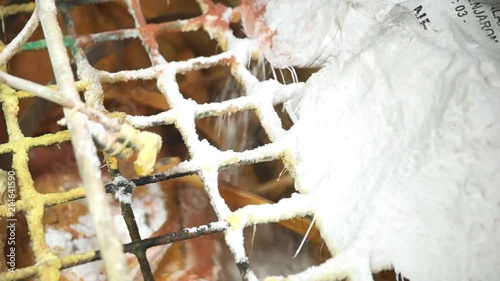 White Fertilizer Being Poured In A Mixing Machine  photo