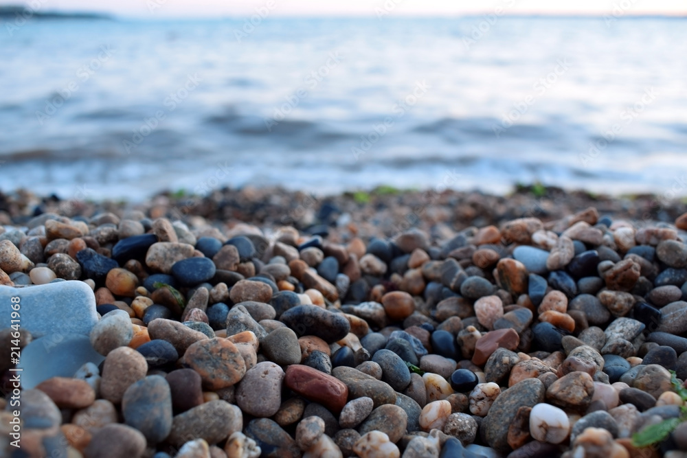 Small pebbles at the beach by the sea Small pebbles at the beach by the sea