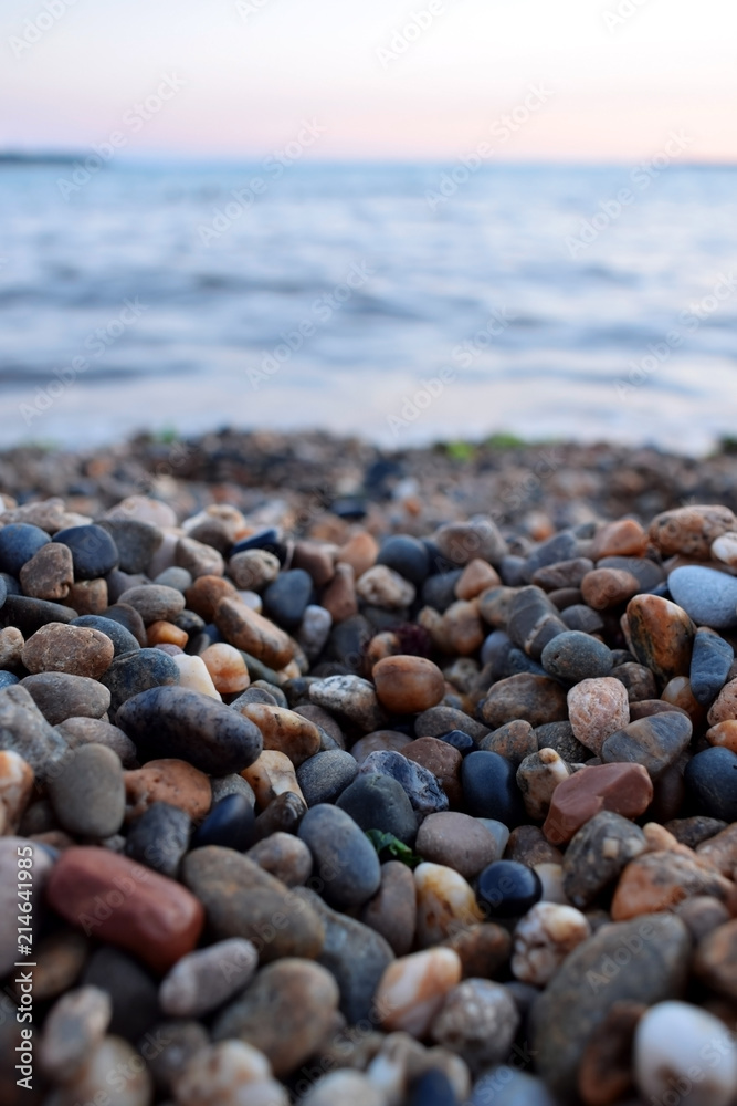 Small pebbles at the beach by the sea Small pebbles at the beach by the sea