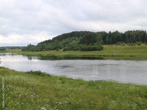picturesque banks of the river in the summer evening