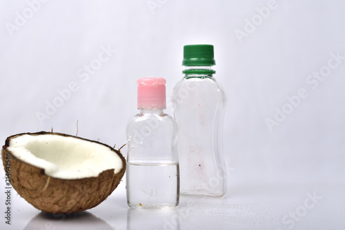 Coconut oil with coconut on white background.