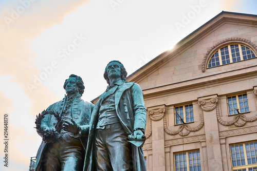 Famous sculpture of Goethe and Schiller in the city of Weimar in Germany / Most famous classical german authors / 18th century photo