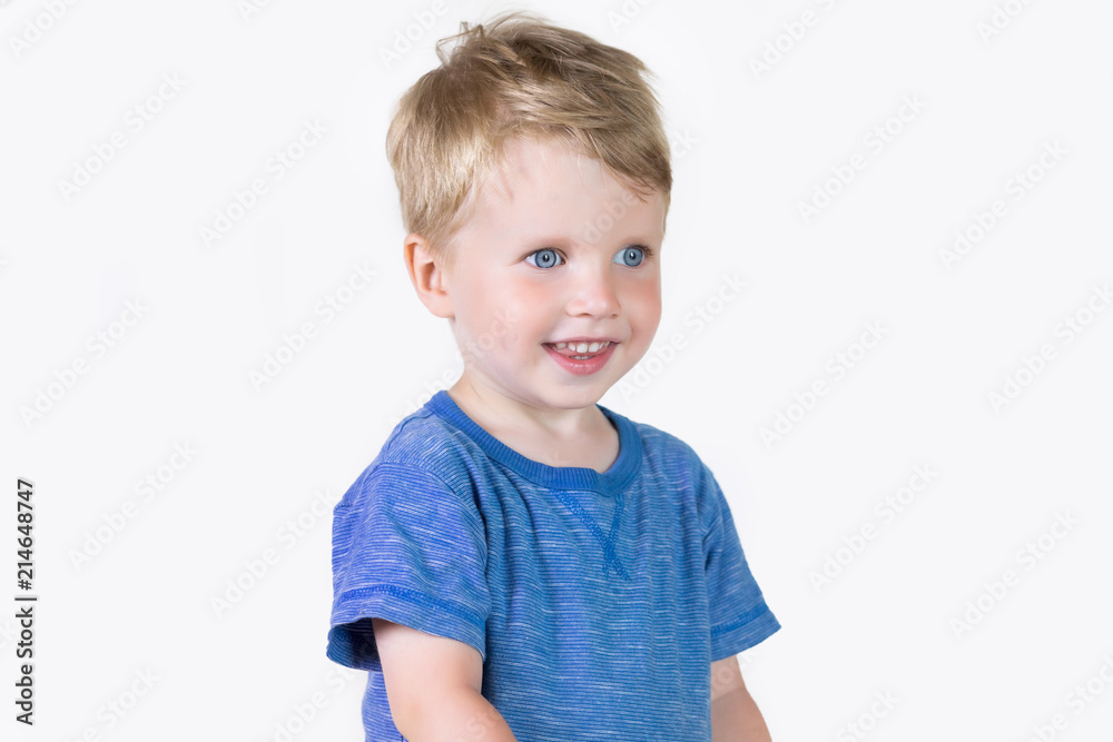 Three years old kid and emotions, close-up portrait of happy smiling child looking at camera at white background Three years old kid and emotions, close-up portrait of happy smiling child looking at camera at white background
