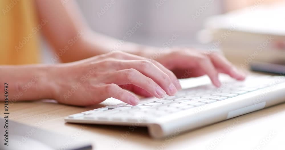 Woman typing on computer keyboard Woman typing on computer keyboard