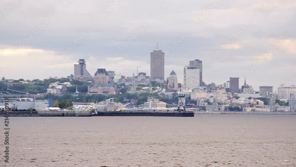 Panning view on cityscape, skyline panoramic panorama of Quebec City, Canada with Saint Lawrence river, port, dock, terminal ships and boats Panning view on cityscape, skyline panoramic panorama of Quebec City, Canada with Saint Lawrence river, port, dock, terminal ships and boats