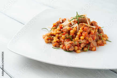 Fototapeta Naklejka Na Ścianę i Meble -  Fregola alla campidanese con sugo e salsiccia