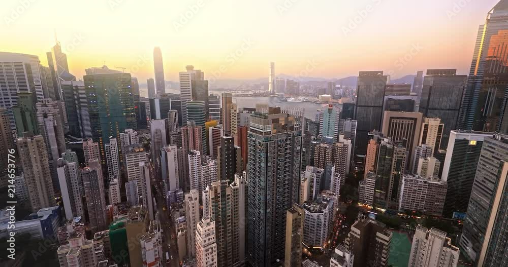 Hong Kong harbor view at sunset. Panoramic skyline cityscape aerial landscape