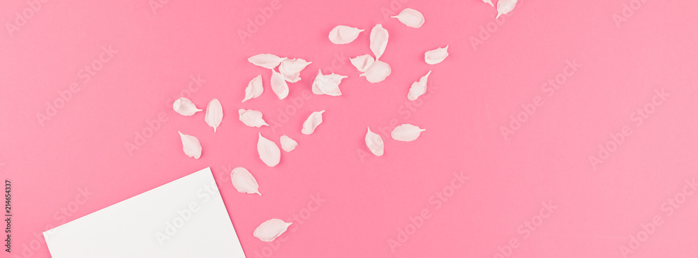 Flat lay of white letter mock up with petals