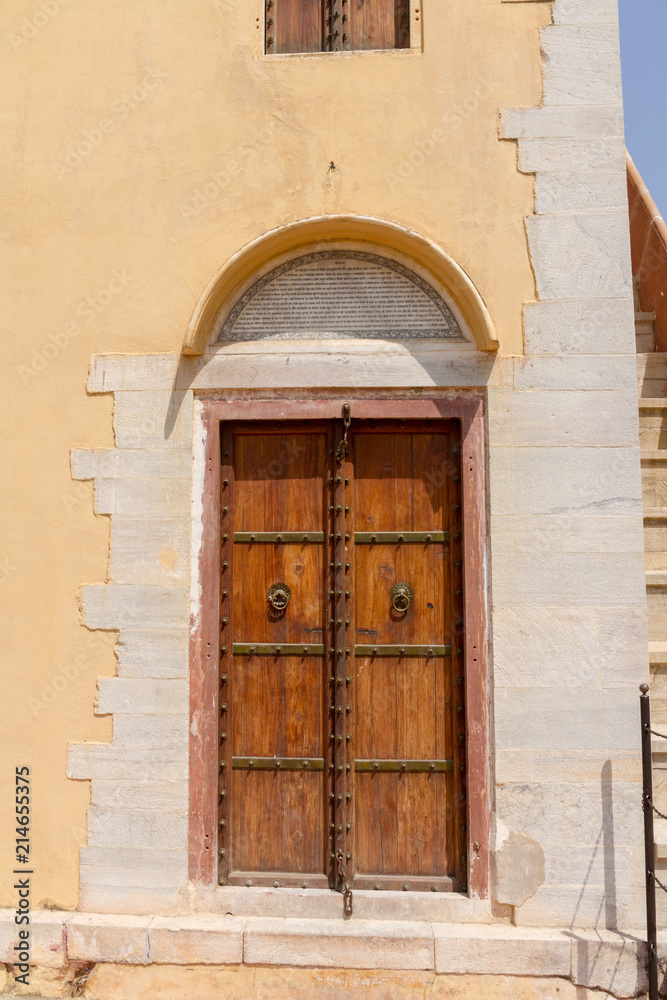 Fototapeta premium Old wooden door with metal embossing in Jaipur, India