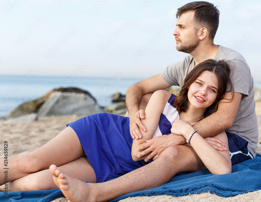 Fototapeta premium Young loving couple resting and hugging