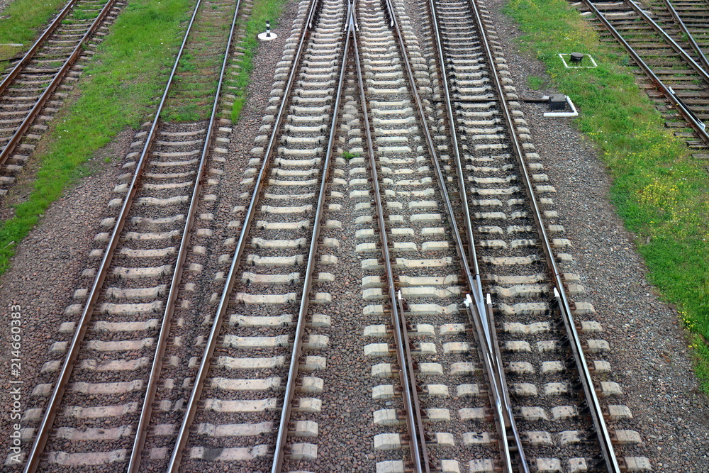 Railway, the top view on rails. Leading parallel steel rails with regular crossbars. Abstract geometric view. Railway, the top view on rails. Leading parallel steel rails with regular crossbars. Abstract geometric view.