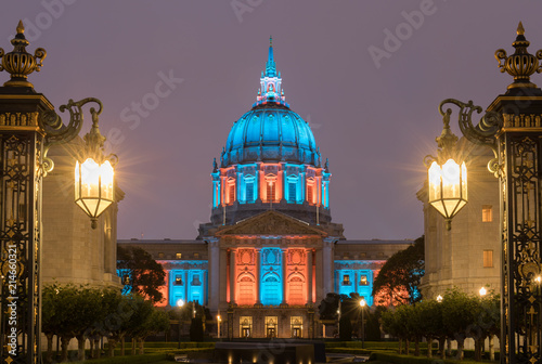 San Francisco City Hall illuminated in Turquoise and Orange. Shot from outside the War Memorial Courtyard, San Francisco, California, USA.