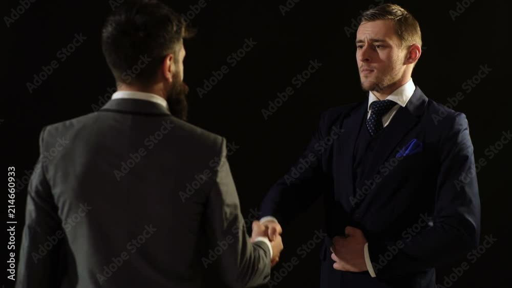 Two business men shake hands in sign of the contract. Two colleagues handshaking after meeting. A successful contract. Two business men shake hands in sign of the contract. Two colleagues handshaking after meeting. A successful contract.