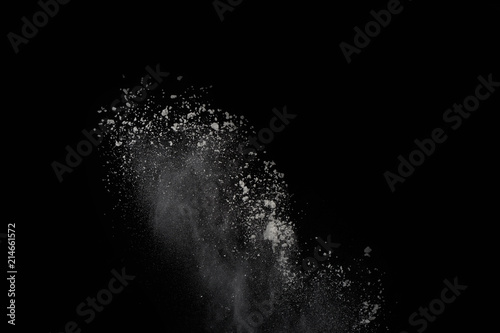 White powder explosion isolated on black background.