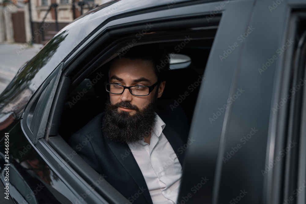 Close up portrair attractive young businessman in a car Close up portrair attractive young businessman in a car