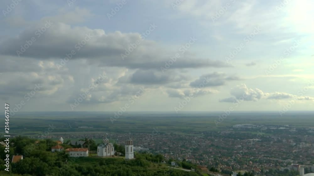 panorama of the city with a church on the hill - clouds time lapse panorama of the city with a church on the hill - clouds time lapse