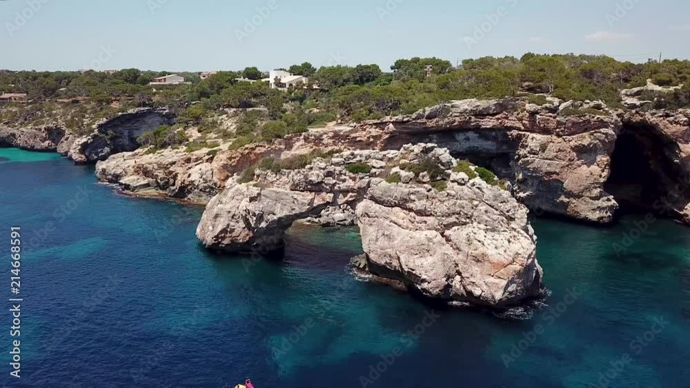 Aerial: Natural arch nearby Cala Santanyi in Mallorca, Spain Aerial: Natural arch nearby Cala Santanyi in Mallorca, Spain