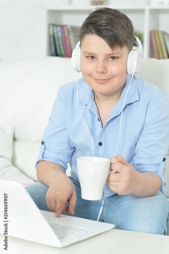 boy using laptop boy using laptop