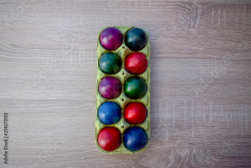 Color Easter Eggs on Wooden Background