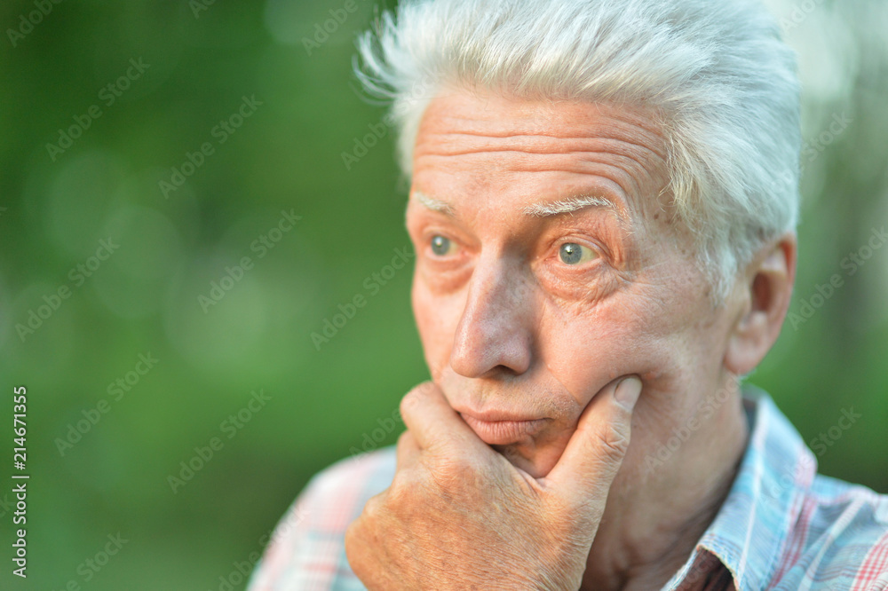 portrait of thoughtful senior man portrait of thoughtful senior man